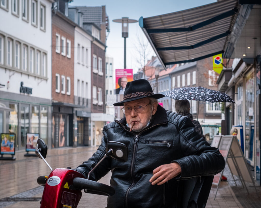 Man with a cigarillo after the rain, Dorsten