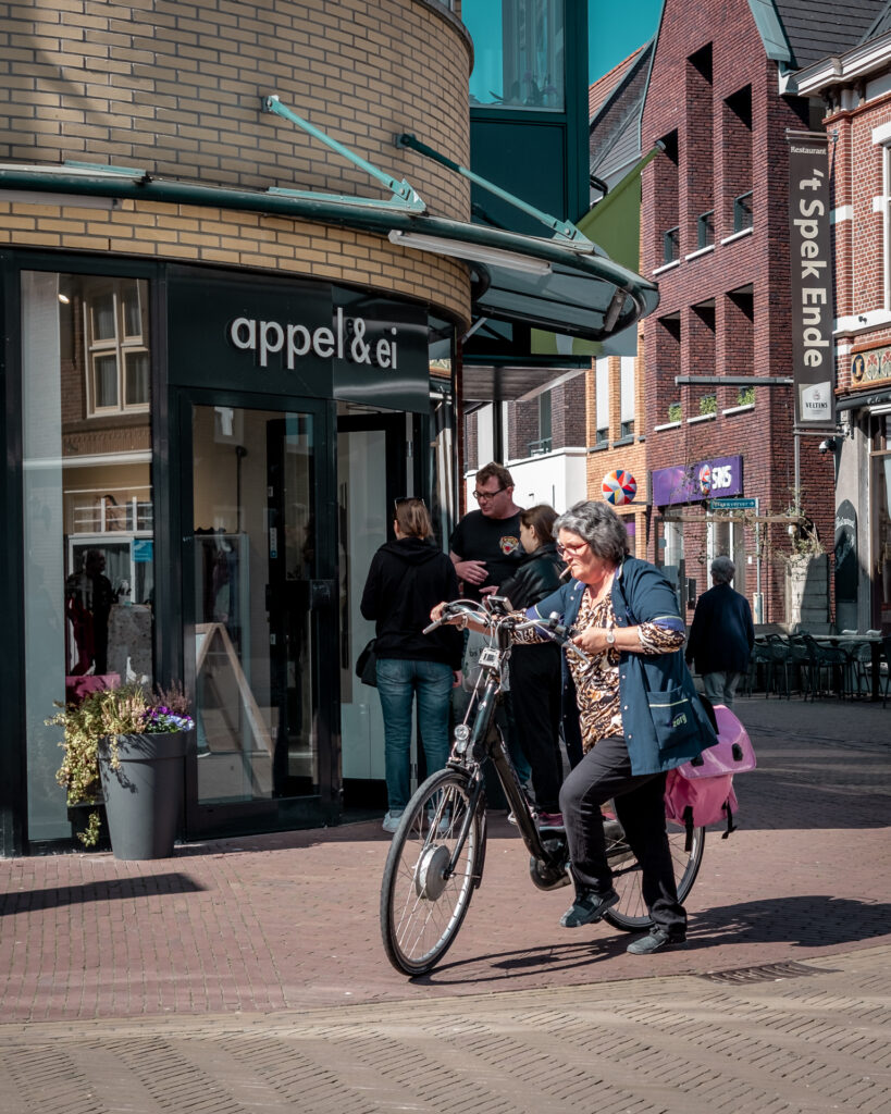 Smoking woman on bicycle 1