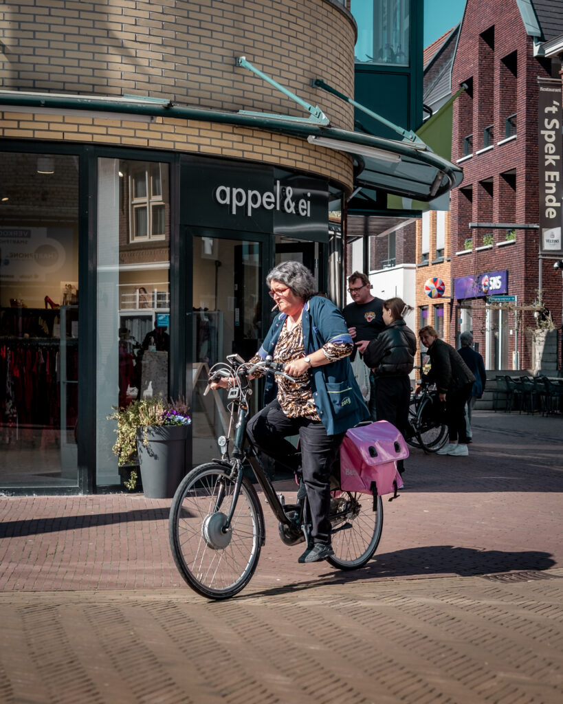Smoking woman on bicycle 2